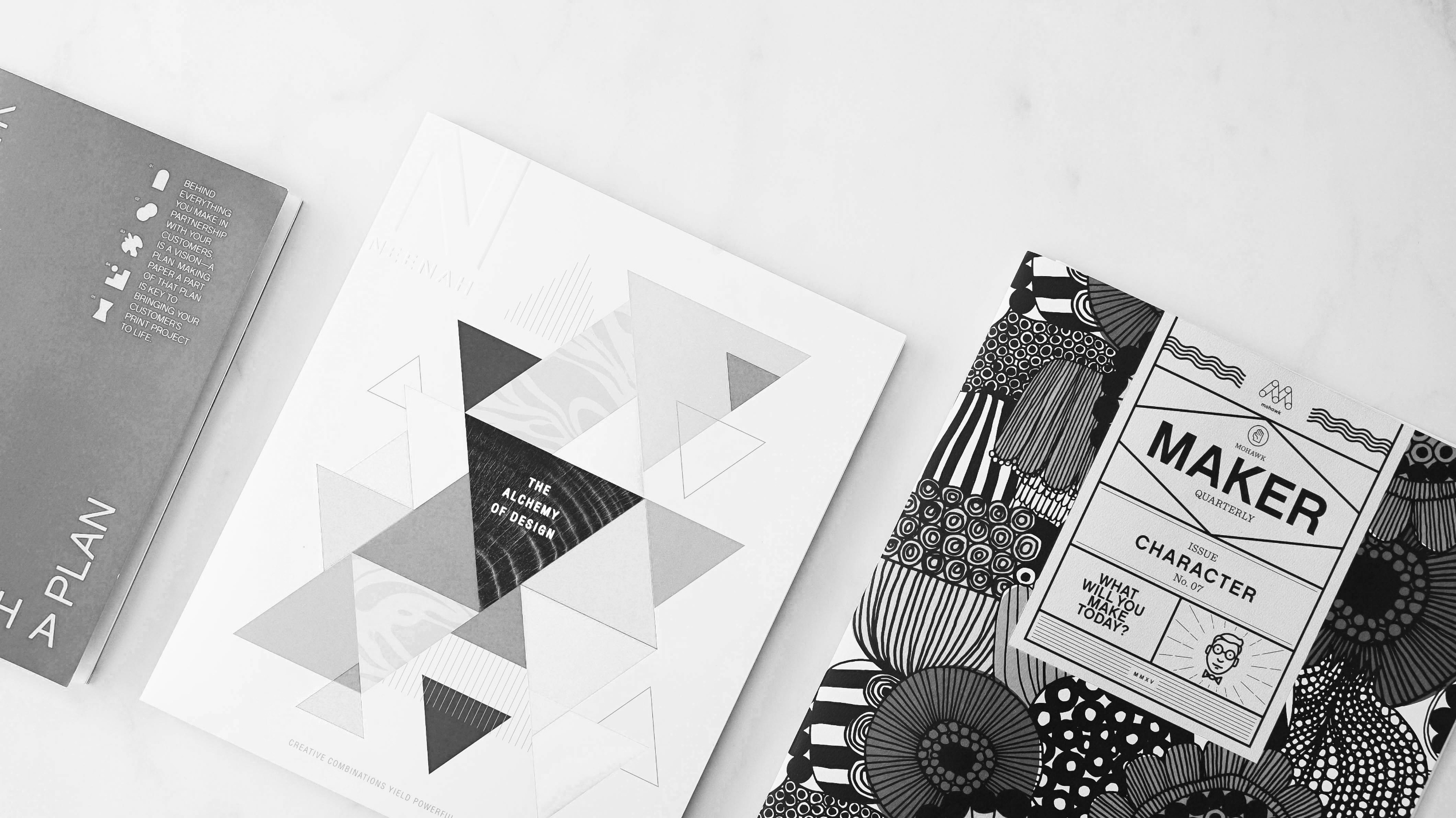 Printed design publications arranged on a light surface